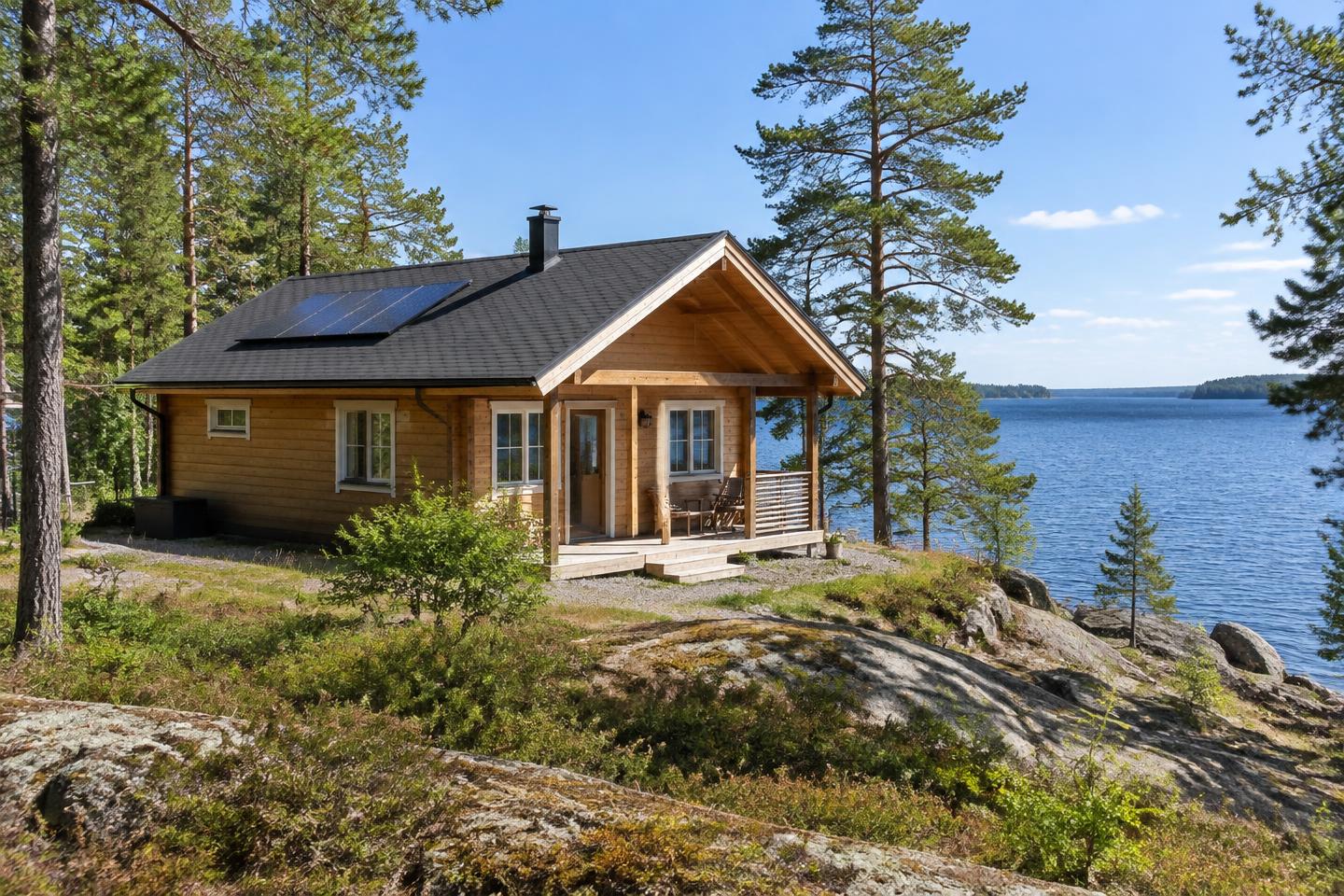 Havainnekuva järvenrantamökistä ja katon aurinkopaneeleista
